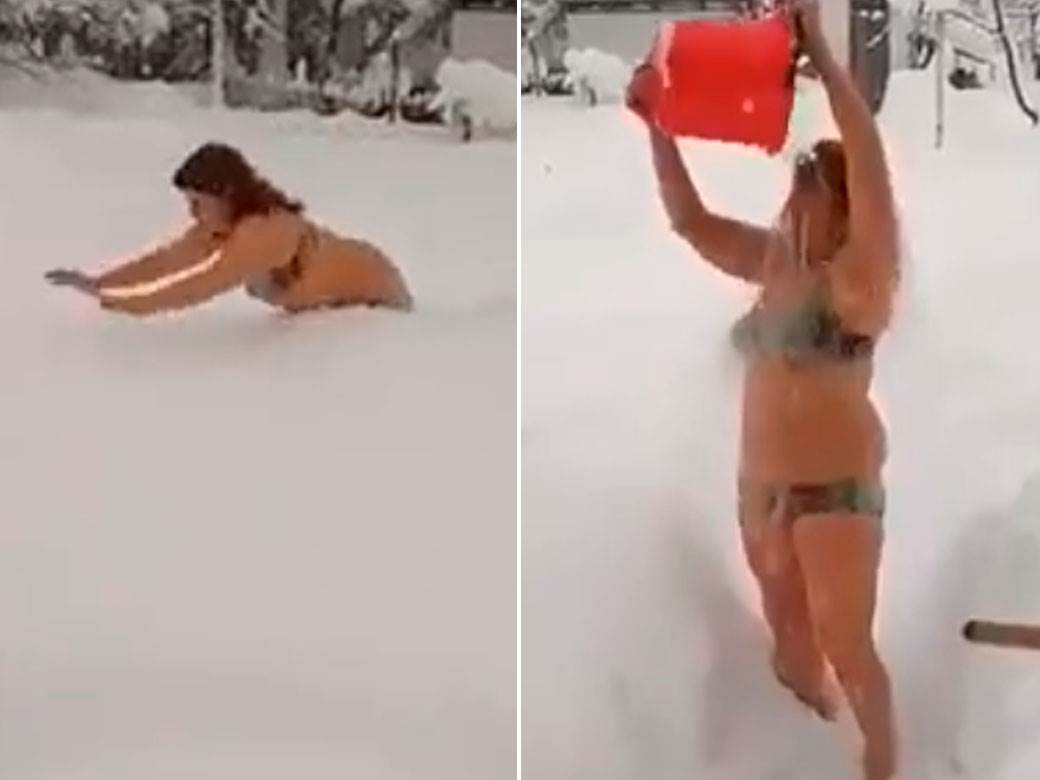  Žena skoro gola čisti sneg 