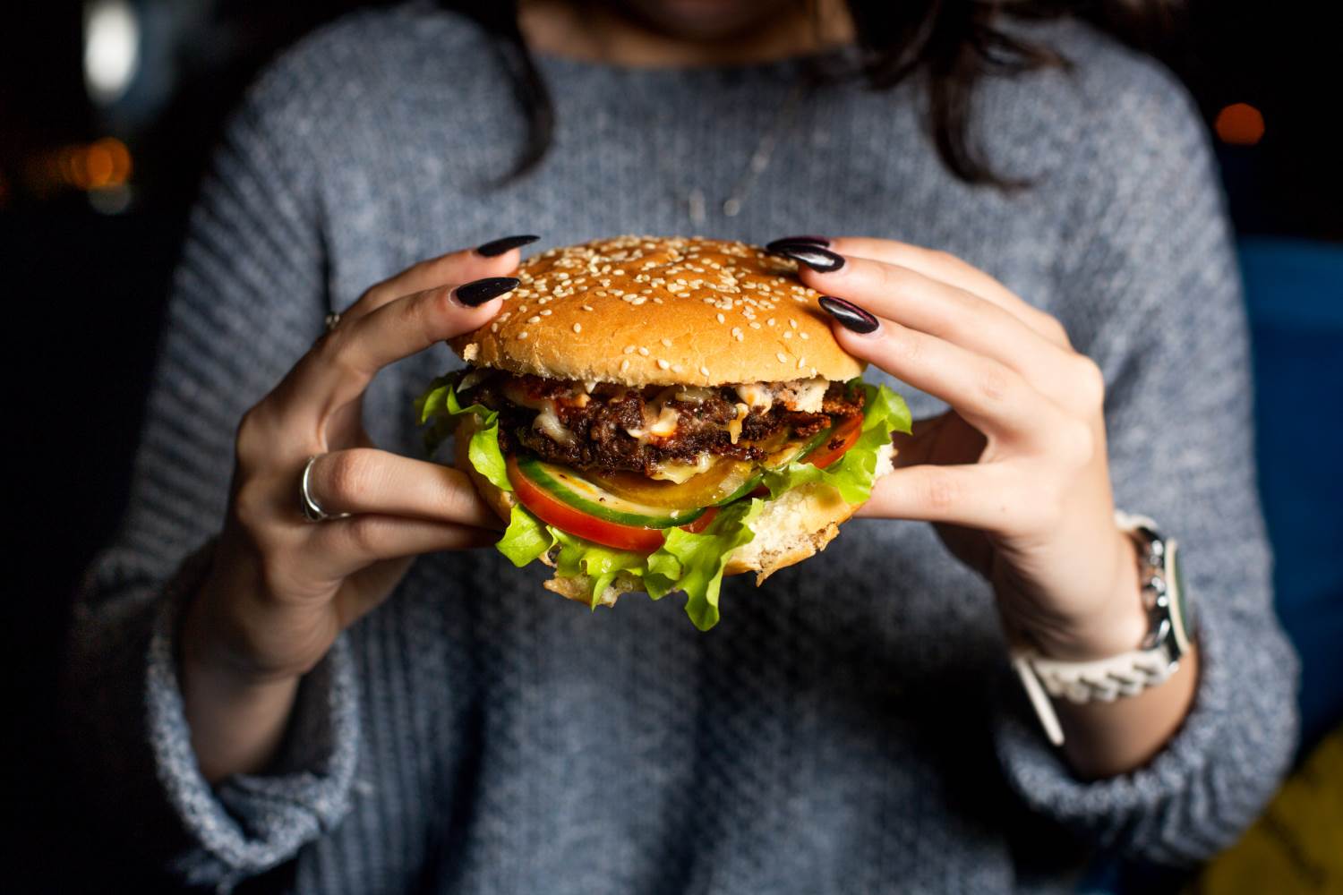  girl-holds-juicy-cheeseburger.jpg 