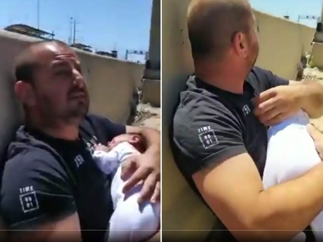  izrael hamas gaza napadi rakete otac drzi bebu video 
